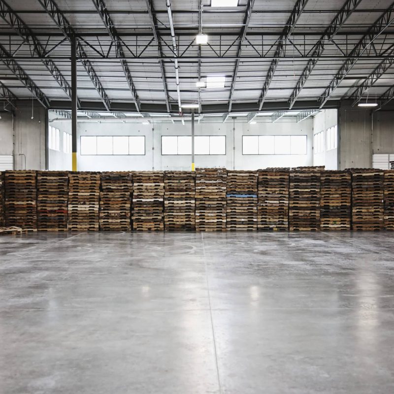 Pallets stacked in warehouse