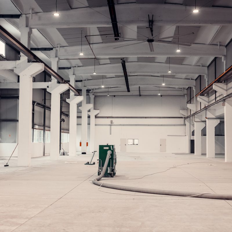 Maintenance for a modern industrial warehouse.  Heat equipment in the ceiling.